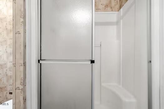 4210 Scronce Road Harrells, NC 28444 - Photo 13 of 28 a bathroom with a glass shower door