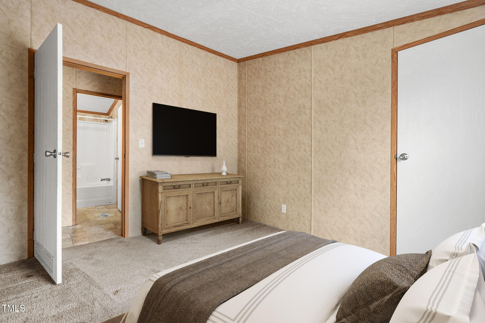 4210 Scronce Road Harrells, NC 28444 - Photo 18 of 28 a bedroom with a bed and a television