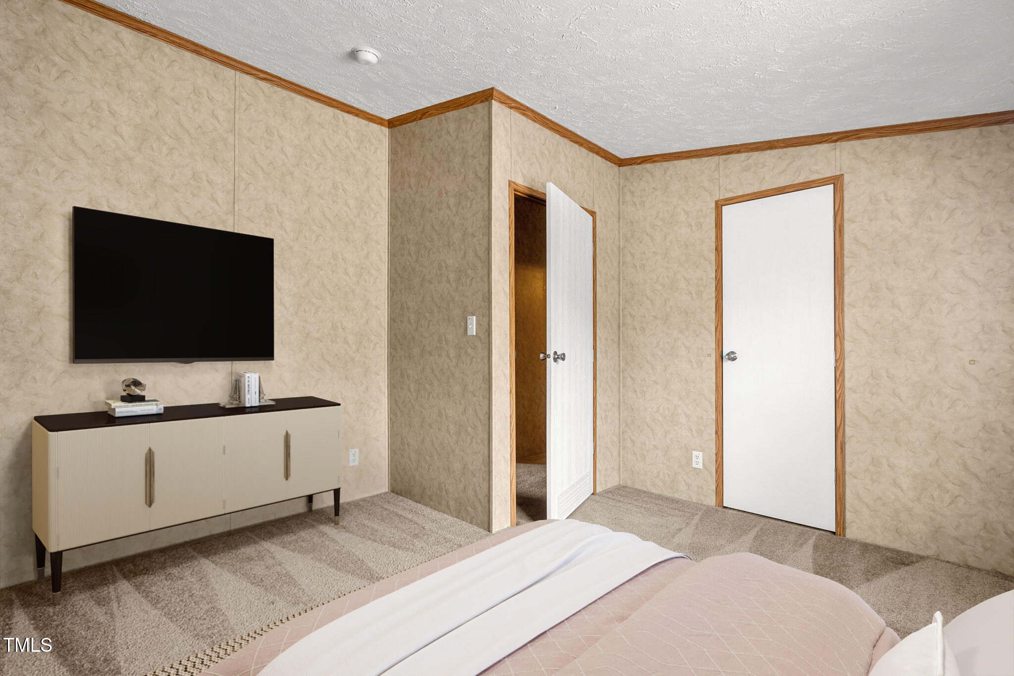 4210 Scronce Road Harrells, NC 28444 - Photo 22 of 28 a bedroom with a bed and a flat screen tv