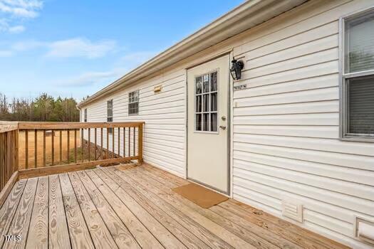 4210 Scronce Road Harrells, NC 28444 - Photo 23 of 28 a view of a wooden deck
