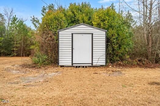 4210 Scronce Road Harrells, NC 28444 - Photo 26 of 28 a front view of a house with a yard
