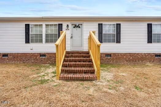 4210 Scronce Road Harrells, NC 28444 - Photo 3 of 28 a view of a house with wooden floor and stairs