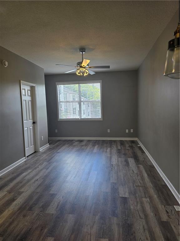 31 Corinth Road Cartersville, GA 30121 - Photo 12 of 35 an empty room with wooden floor and windows