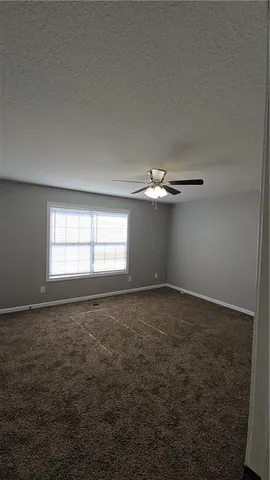 an empty room with a empty space and a window