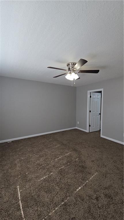 31 Corinth Road Cartersville, GA 30121 - Photo 19 of 35 a view of a livingroom with a fan