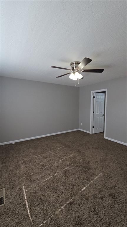 31 Corinth Road Cartersville, GA 30121 - Photo 20 of 35 a view of a livingroom with a fan