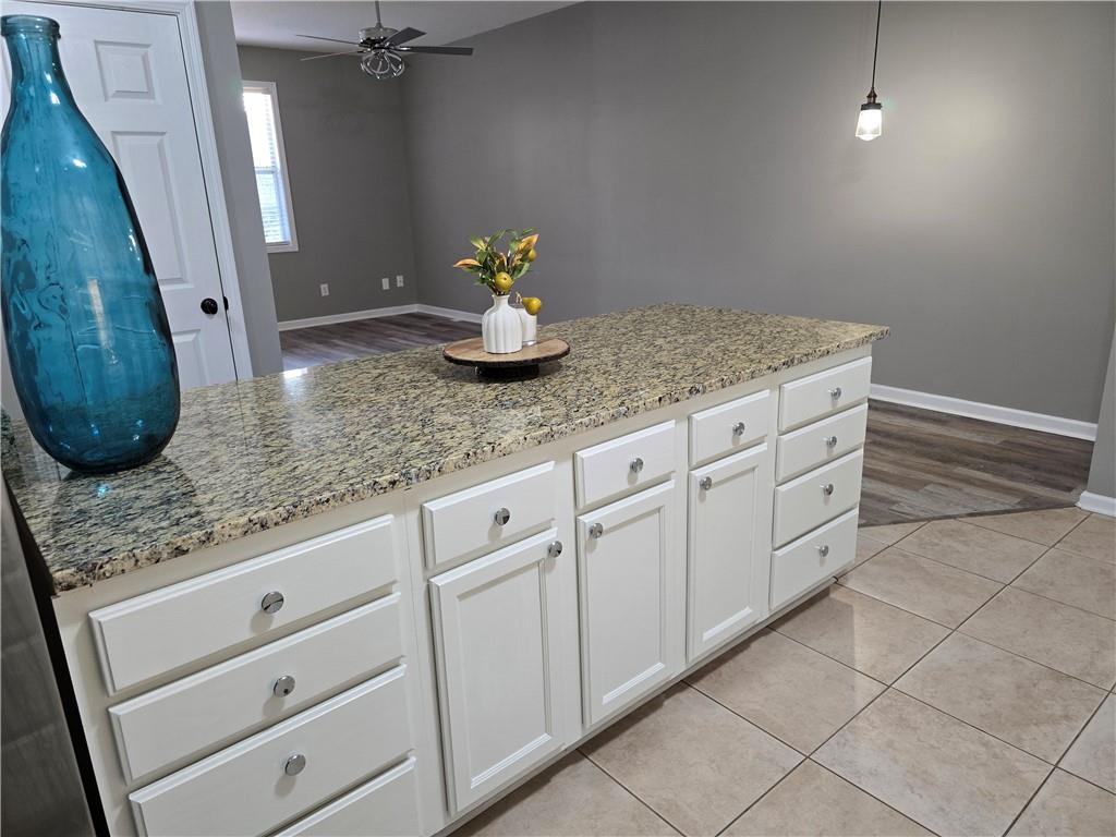 31 Corinth Road Cartersville, GA 30121 - Photo 9 of 35 a bathroom with a granite countertop sink and a mirror