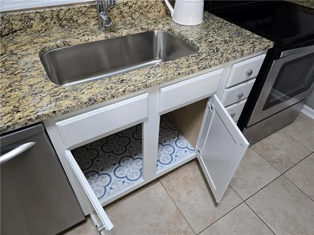 a kitchen with a stove and a microwave