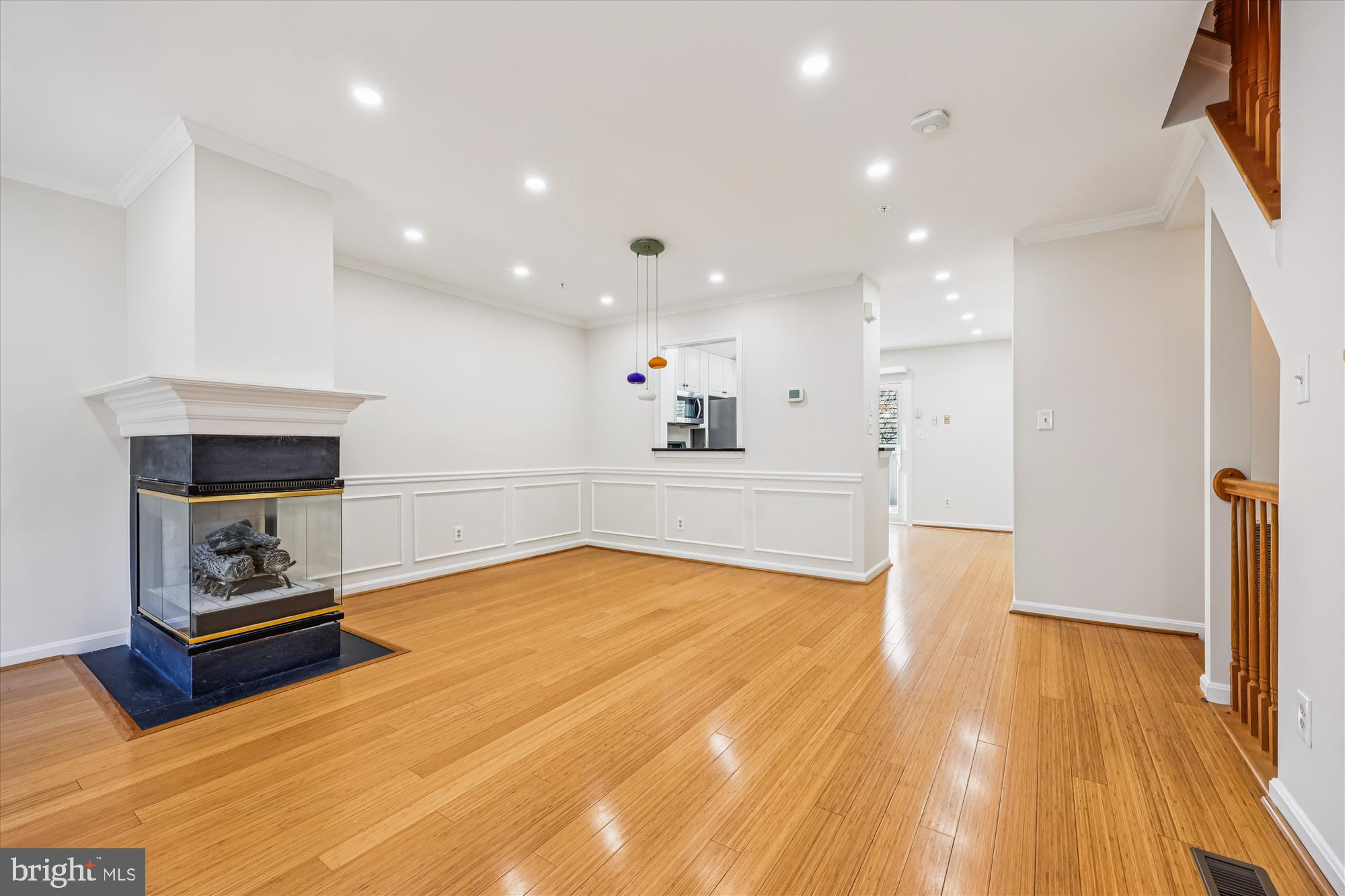 536 Tschiffely Square Road Gaithersburg, MD 20878 - Photo 48 of 116 a view of kitchen and empty room with wooden floor