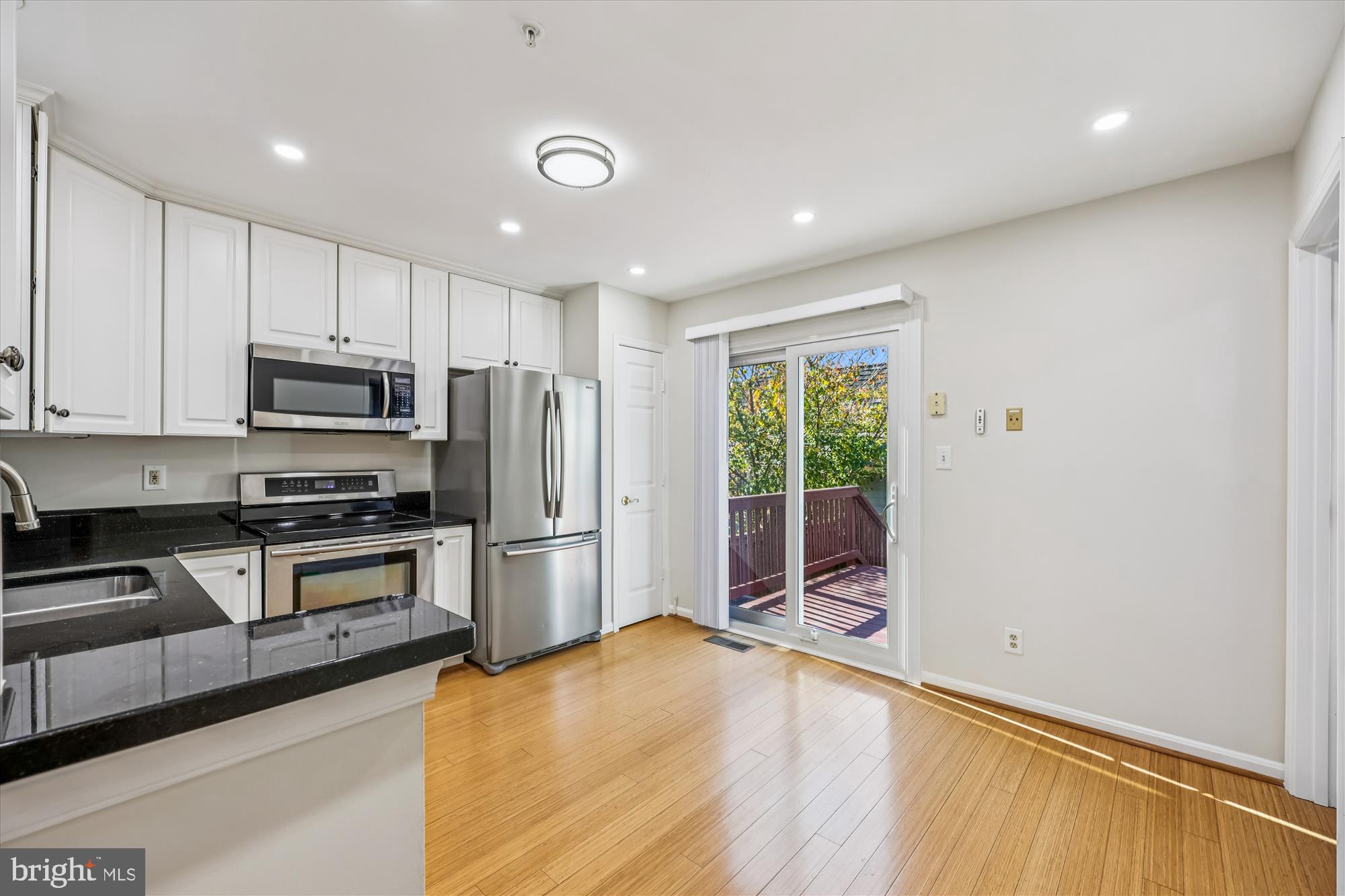 536 Tschiffely Square Road Gaithersburg, MD 20878 - Photo 54 of 116 a kitchen with stainless steel appliances granite countertop a refrigerator a stove a sink and a microwave