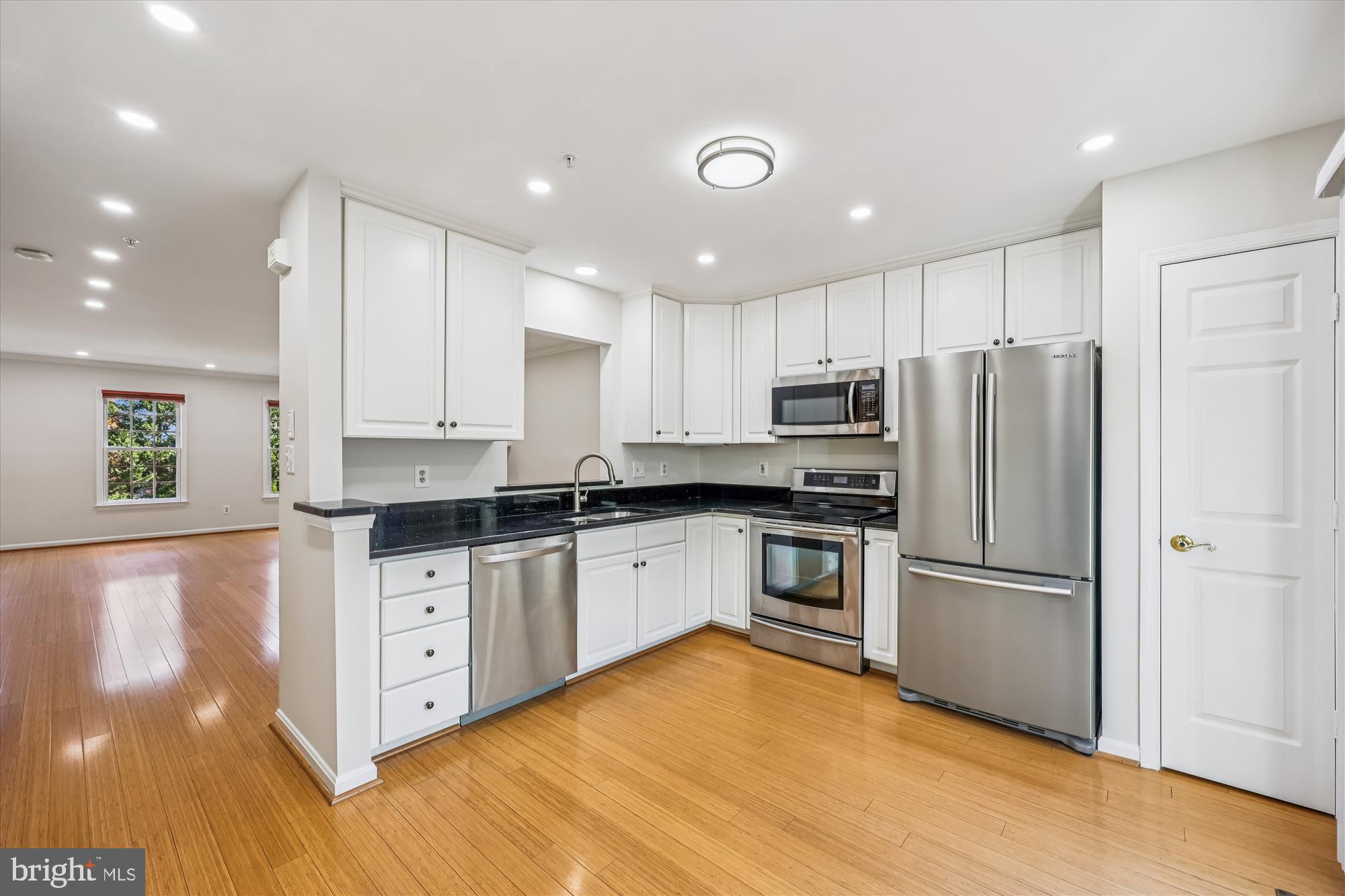 536 Tschiffely Square Road Gaithersburg, MD 20878 - Photo 55 of 116 a kitchen with granite countertop a refrigerator stove top oven and sink