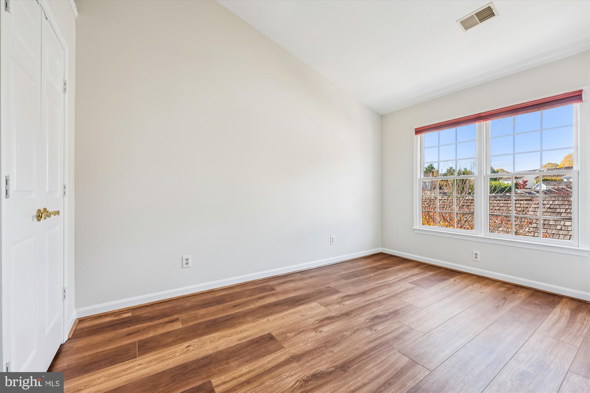 536 Tschiffely Square Road Gaithersburg, MD 20878 - Photo 69 of 116 an empty room with wooden floor and windows