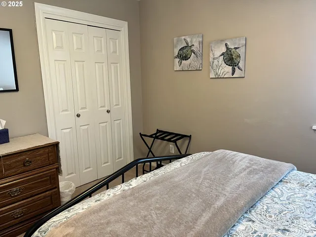 a bedroom with a bed and cabinets