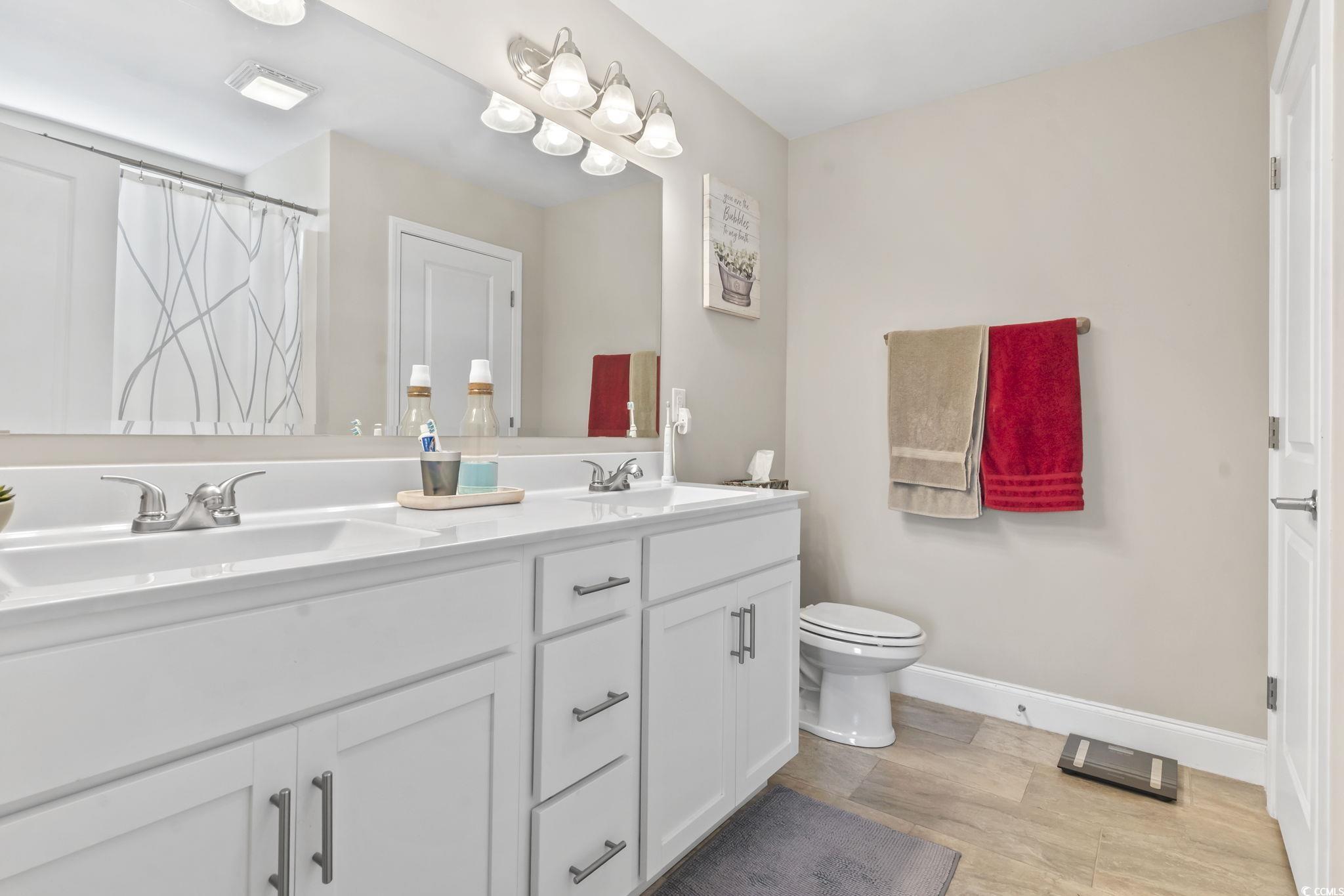 1170 Daisy Road Loris, SC 29569 - Photo 25 of 35 Bathroom featuring toilet and double vanity