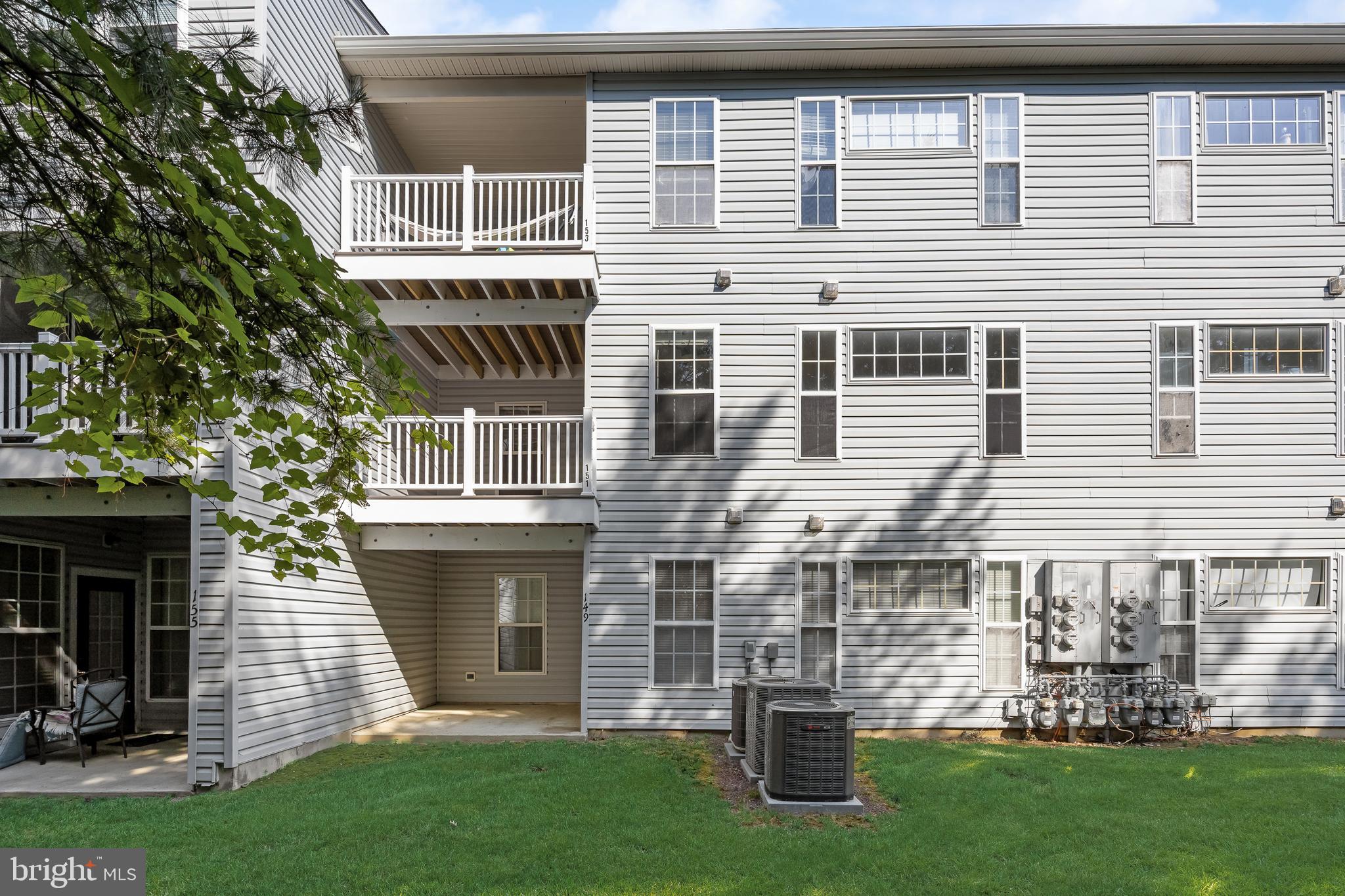 151 Wildflower Place Delran, NJ 08075 - Photo 24 of 29 a front view of a house with a garden