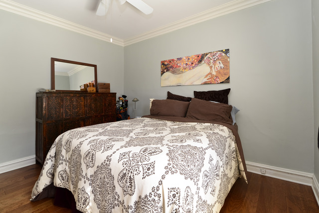 751 West Brompton Avenue, Unit 2E Chicago, IL 60657 - Photo 8 of 10 a bedroom with a bed and painting on the wall