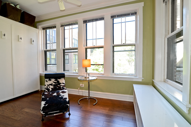 751 West Brompton Avenue, Unit 2E Chicago, IL 60657 - Photo 10 of 10 a living room with furniture and a large window with outer view
