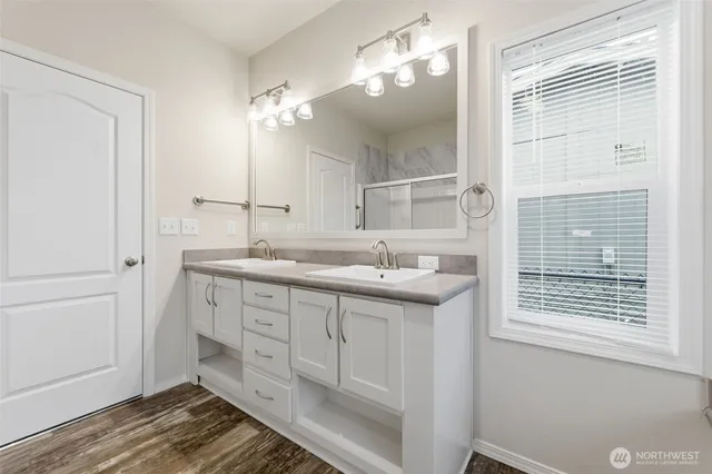 a bathroom with a sink and a mirror