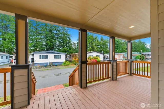 a view of a two chairs in the balcony