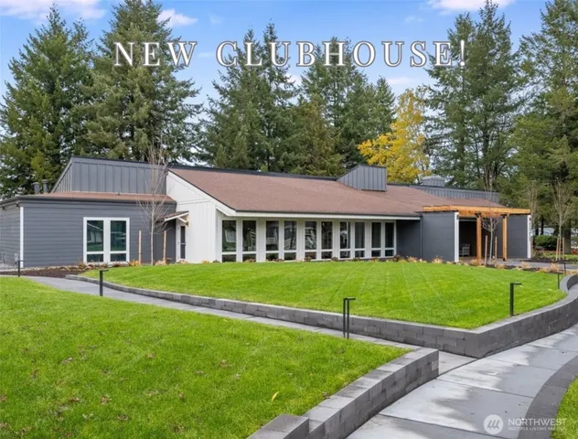 a kitchen with a sink refrigerator and cabinets