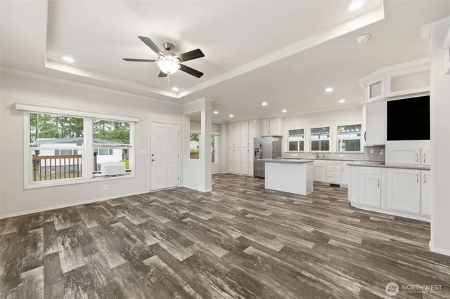 a view of a livingroom with a kitchen