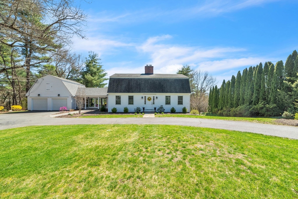 561 Station Road Amherst, MA 01002 - Photo 1 of 41 a front view of a house with a yard and fountain