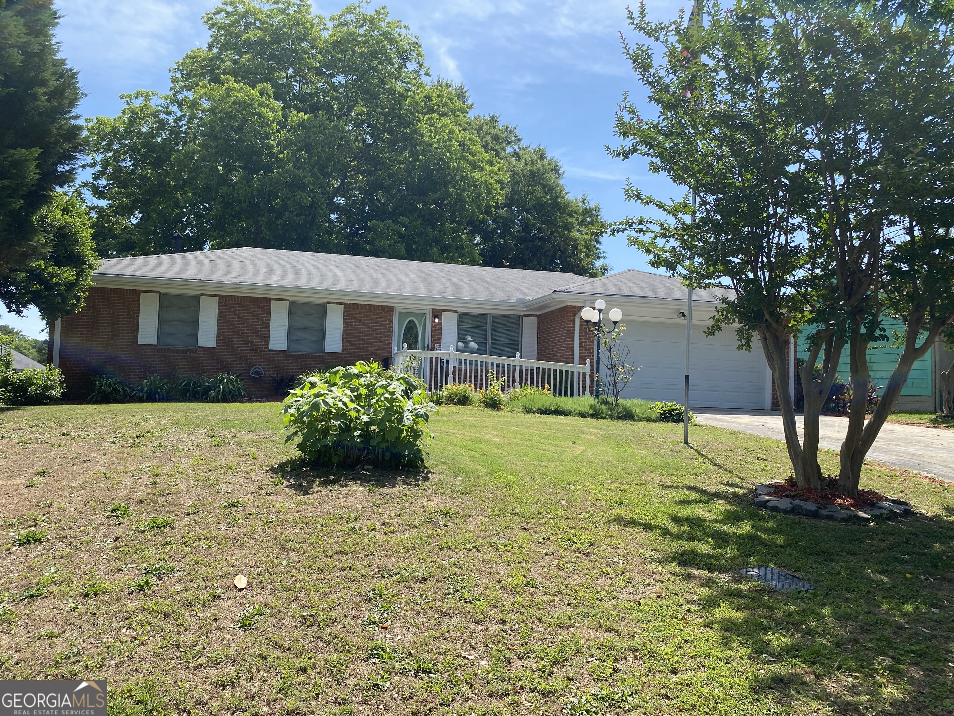 a front view of a house with garden