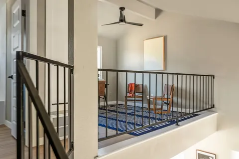 a view of staircase with wooden floor and stairs