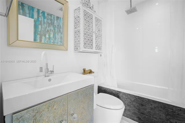 aerial view of a swimming pool with a yard and plants