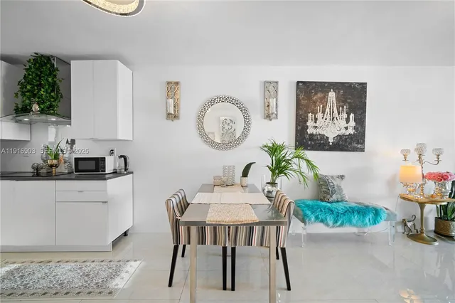 a room with furniture a chandelier and a window