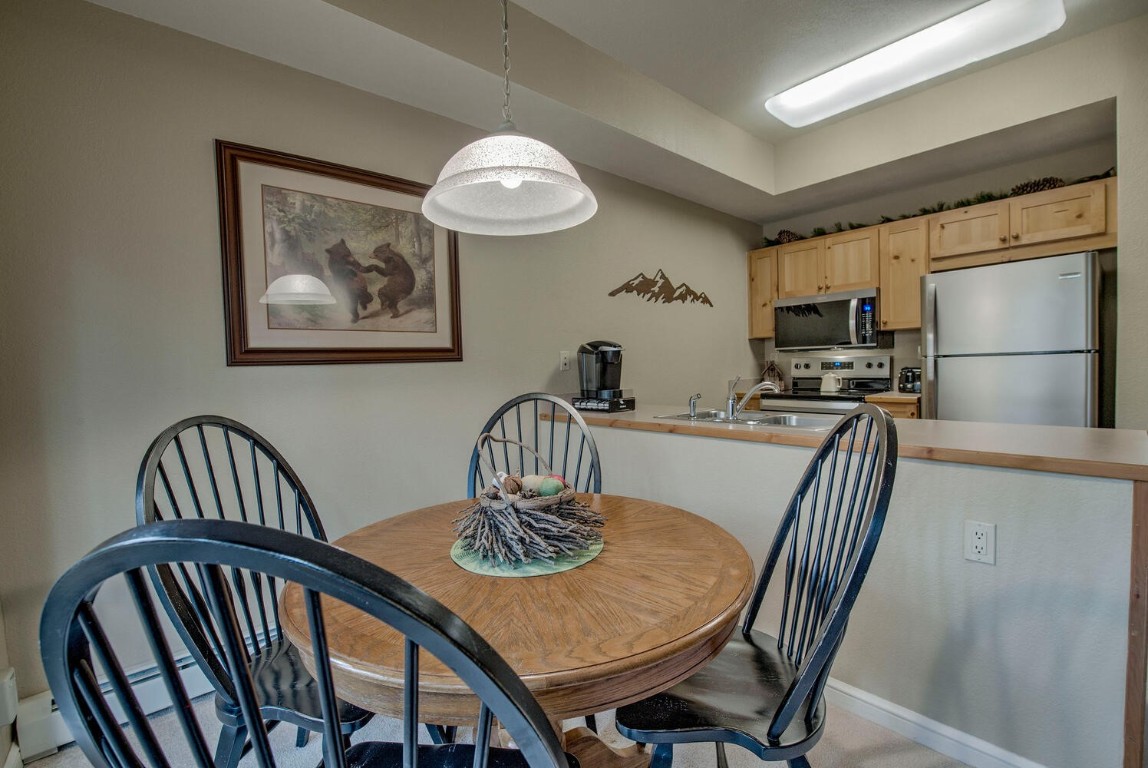 97 Lake Ridge Circle, Unit 1854 Keystone, CO 80435 - Photo 15 of 38 a view of a dining room with furniture