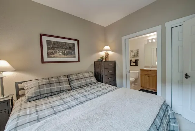 a bedroom with a bed and a cabinets