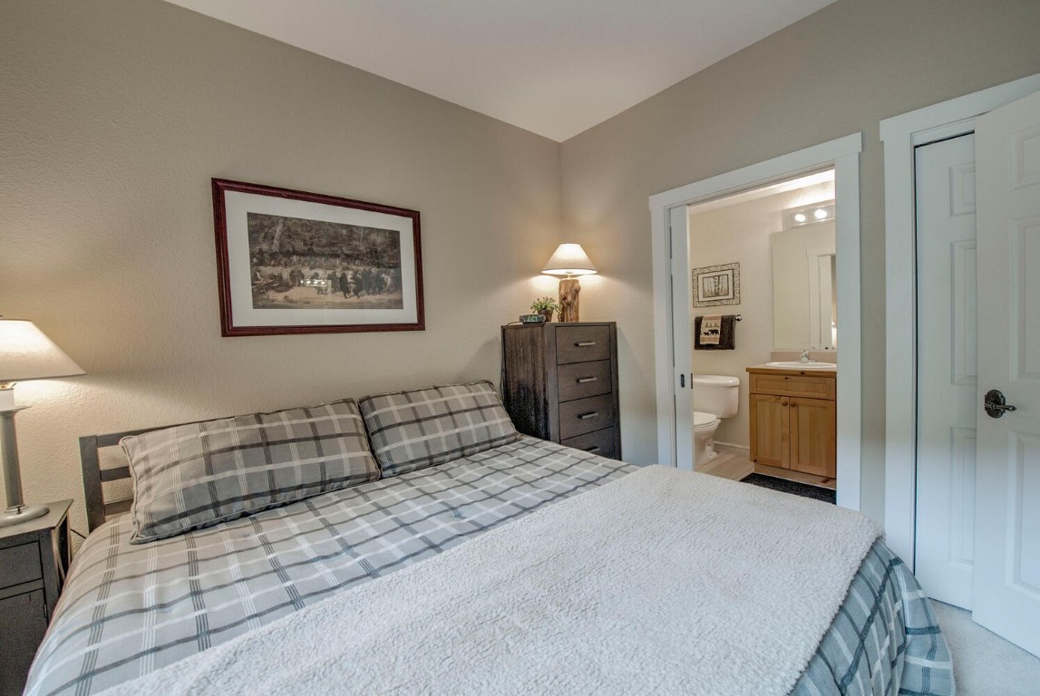 97 Lake Ridge Circle, Unit 1854 Keystone, CO 80435 - Photo 17 of 38 a bedroom with a bed and a cabinets