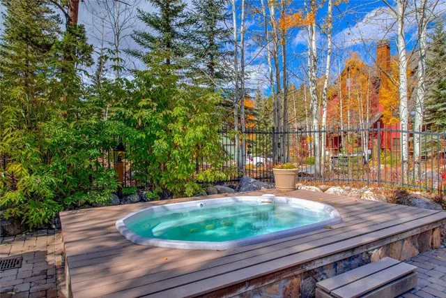 a view of a backyard with sitting area