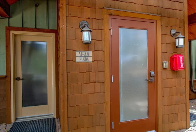 a bathroom with a shower and a sink
