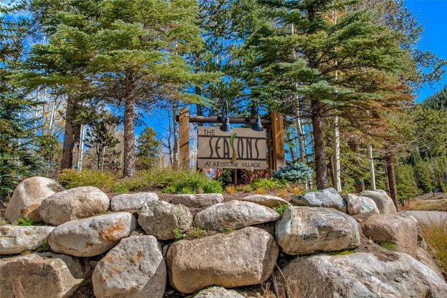 a view of patio with couches and potted plants