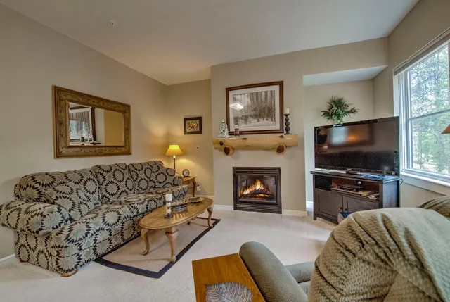 a bedroom with furniture and a flat screen tv
