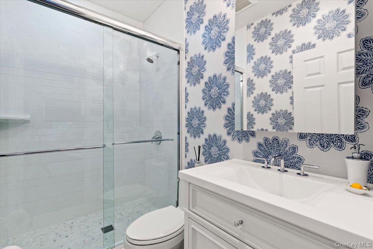 6 Valley Place Harrison, NY 10528 - Photo 16 of 37 a bathroom with a sink a toilet and shower