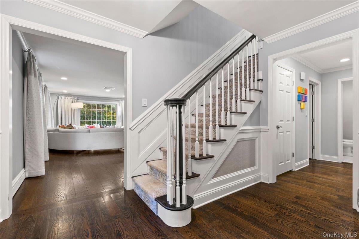 6 Valley Place Harrison, NY 10528 - Photo 2 of 37 a view of entryway with wooden floor and stairs