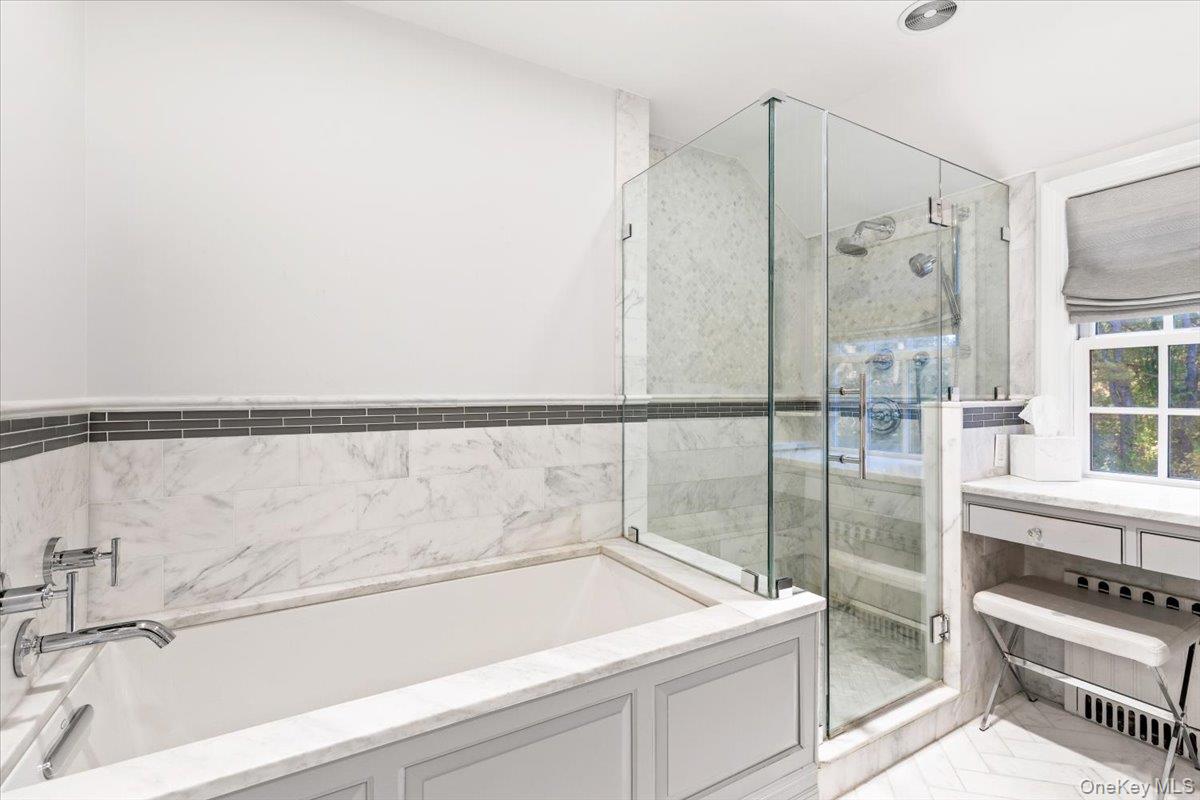 6 Valley Place Harrison, NY 10528 - Photo 21 of 37 a bathroom with a tub and a shower