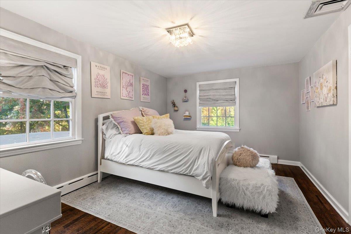 6 Valley Place Harrison, NY 10528 - Photo 22 of 37 a bedroom with a bed and a window