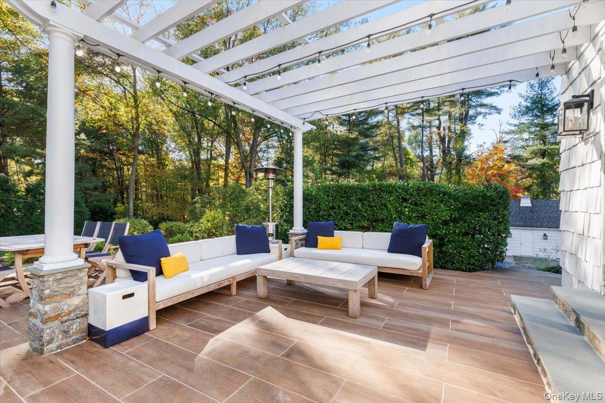 6 Valley Place Harrison, NY 10528 - Photo 28 of 37 a living room with patio furniture and garden view