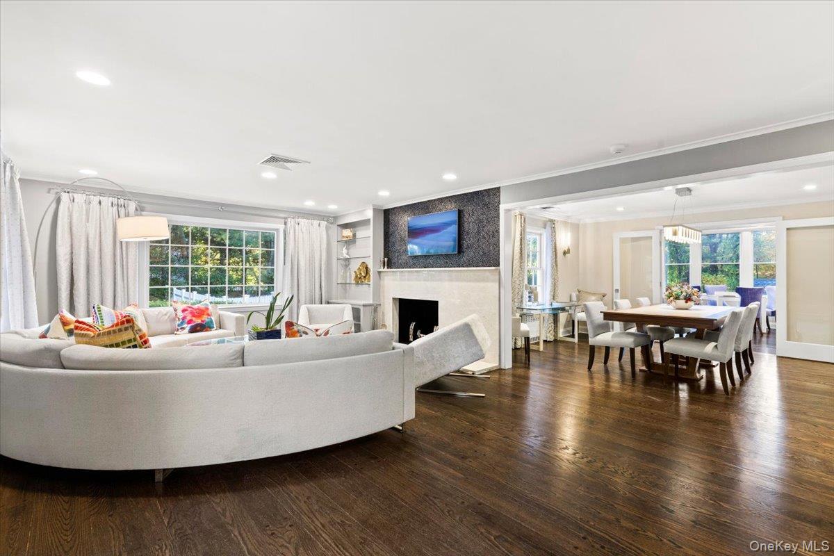 6 Valley Place Harrison, NY 10528 - Photo 37 of 37 a living room with furniture a large window and a fireplace