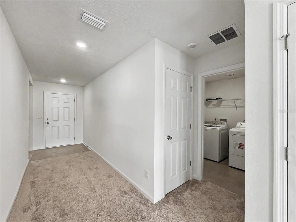 55 Signet Circle Flagler Beach, FL 32136 - Photo 14 of 39 a view of a hallway with closet and a window