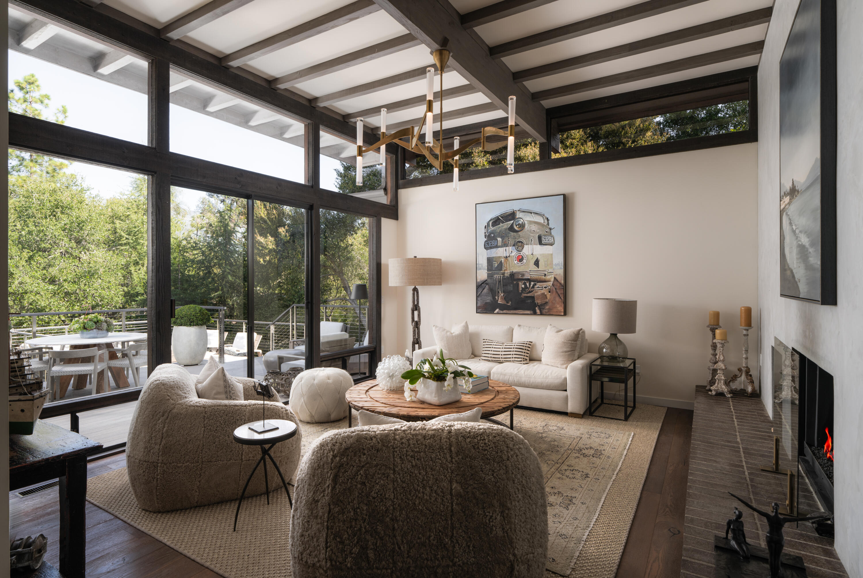 a living room with furniture large window and flat screen tv