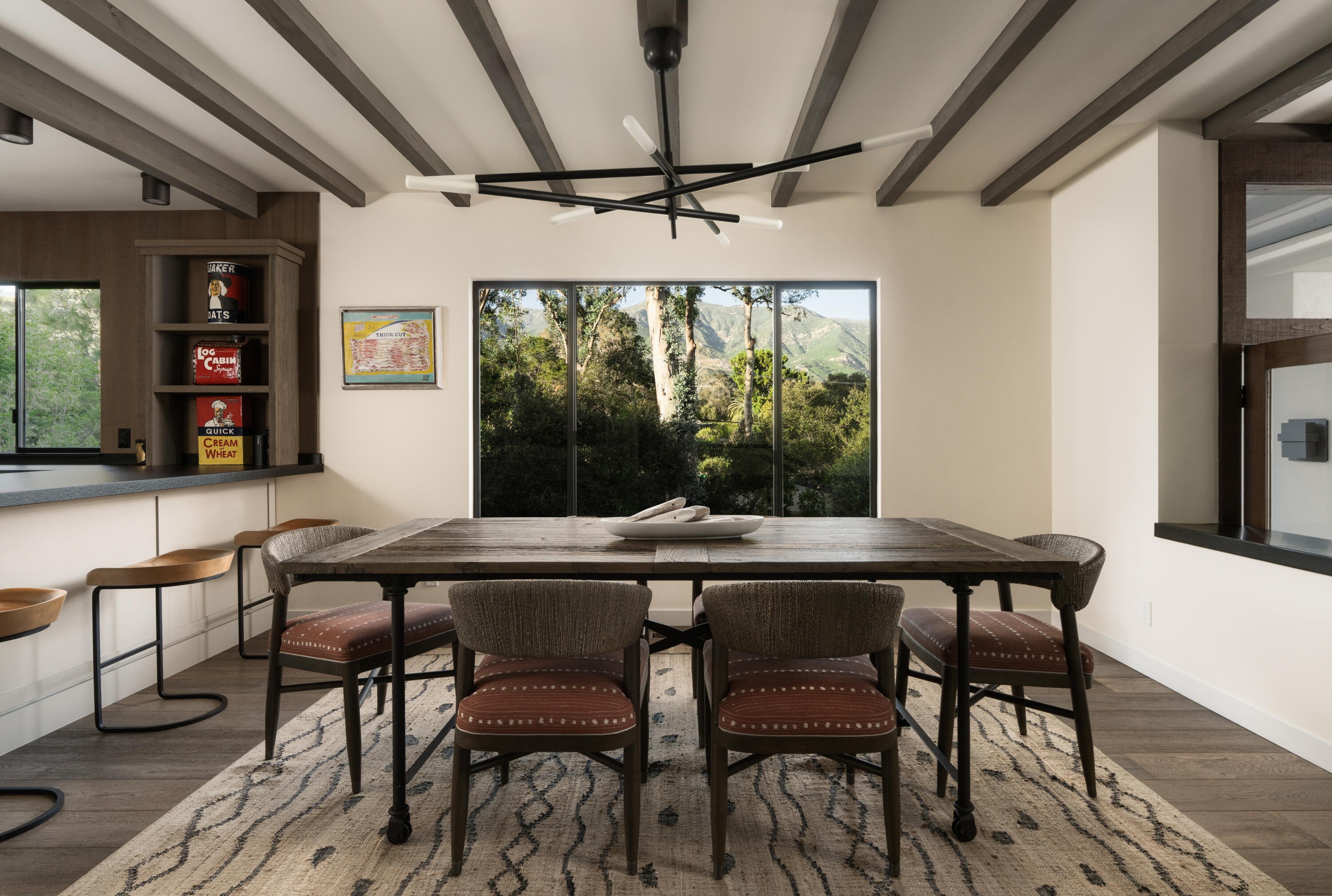 1103 Camino Viejo Road Montecito, CA 93108 - Photo 10 of 27 a dining room with furniture a chandelier and wooden floor