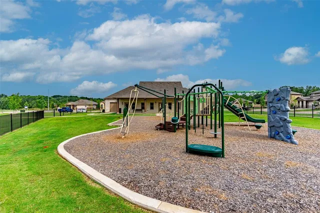 a childrens park with lots of swings and slides