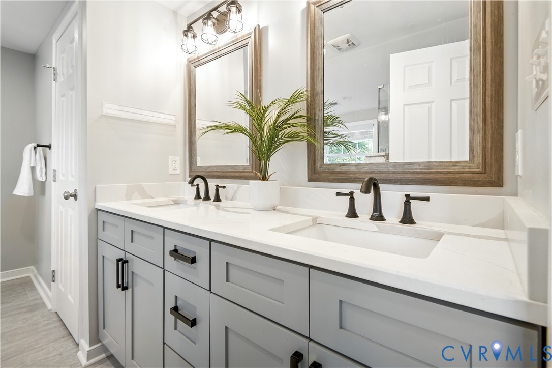 6304 Engel Road Richmond, VA 23226 - Photo 15 of 37 a bathroom with a sink and a mirror