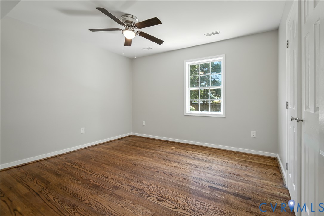 6304 Engel Road Richmond, VA 23226 - Photo 18 of 37 a view of an empty room with wooden floor and a window