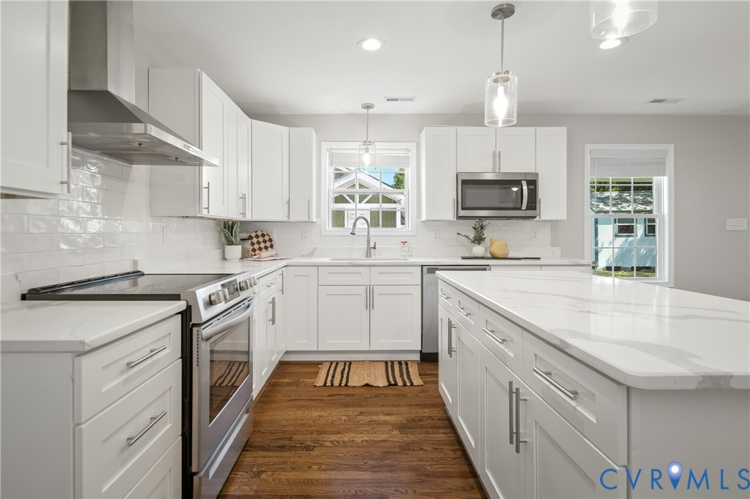 6304 Engel Road Richmond, VA 23226 - Photo 9 of 37 a kitchen with a sink stove and cabinets
